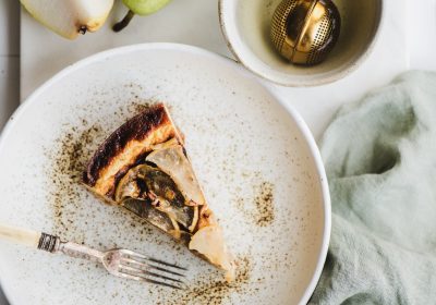Flat-lay of vegan dairy-free sugar-free pear cheesecake piece Flat-lay of vegan dairy-free sugar-free pear cheesecake piece